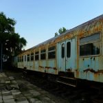 Early Morning Among Rusty Carriages. Decaying Trai...